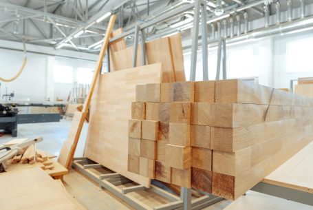 stacked-wooden-bars-in-workshop-of-furniture-manuf-2023-11-27-05-37-17-utc